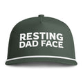 Image of a green hat with white embroidery reading "Resting Dad Face"