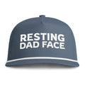 Image of an indigo hat with white embroidery reading "Resting Dad Face"