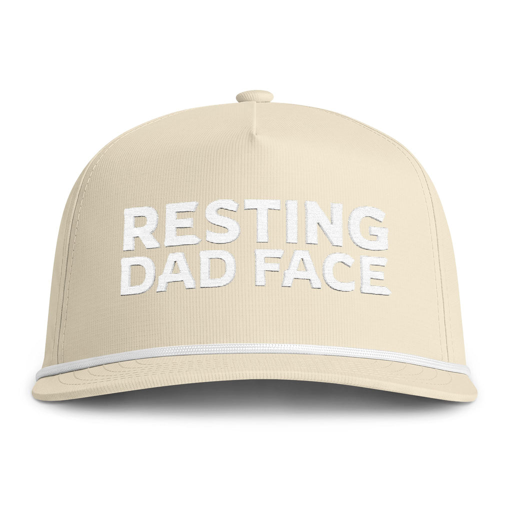 Image of an ivory hat with white embroidery reading "Resting Dad Face"