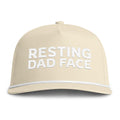 Image of an ivory hat with white embroidery reading "Resting Dad Face"
