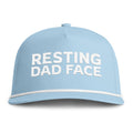 Image of a light blue hat with white embroidery reading "Resting Dad Face"