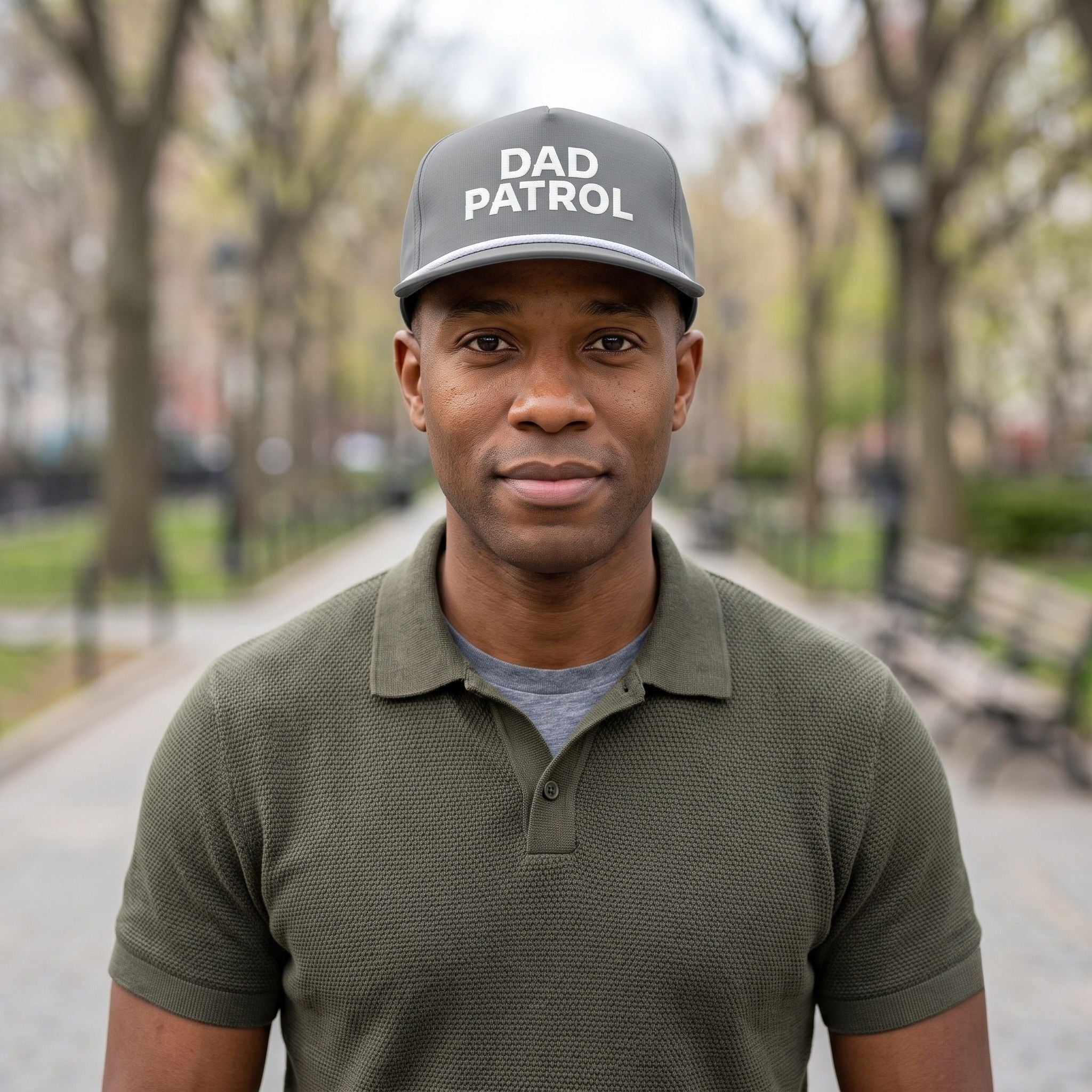 Image of a man wearing a grey cap with "Dad Patrol" embroidery