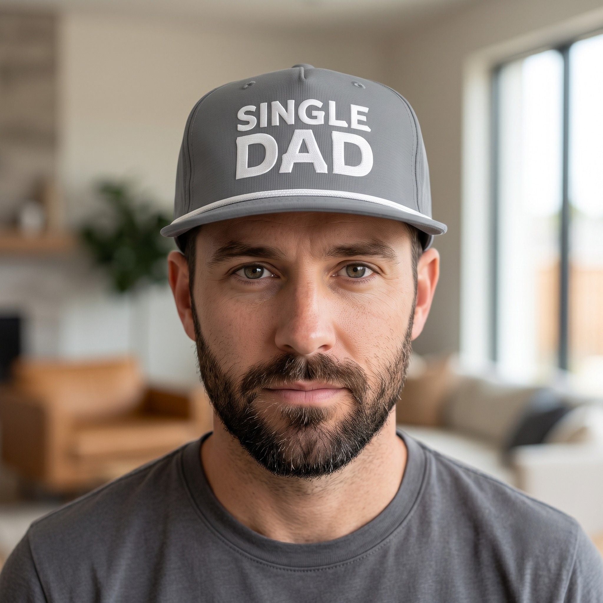 Image of a man wearing a grey cap with "Single Dad" embroidery
