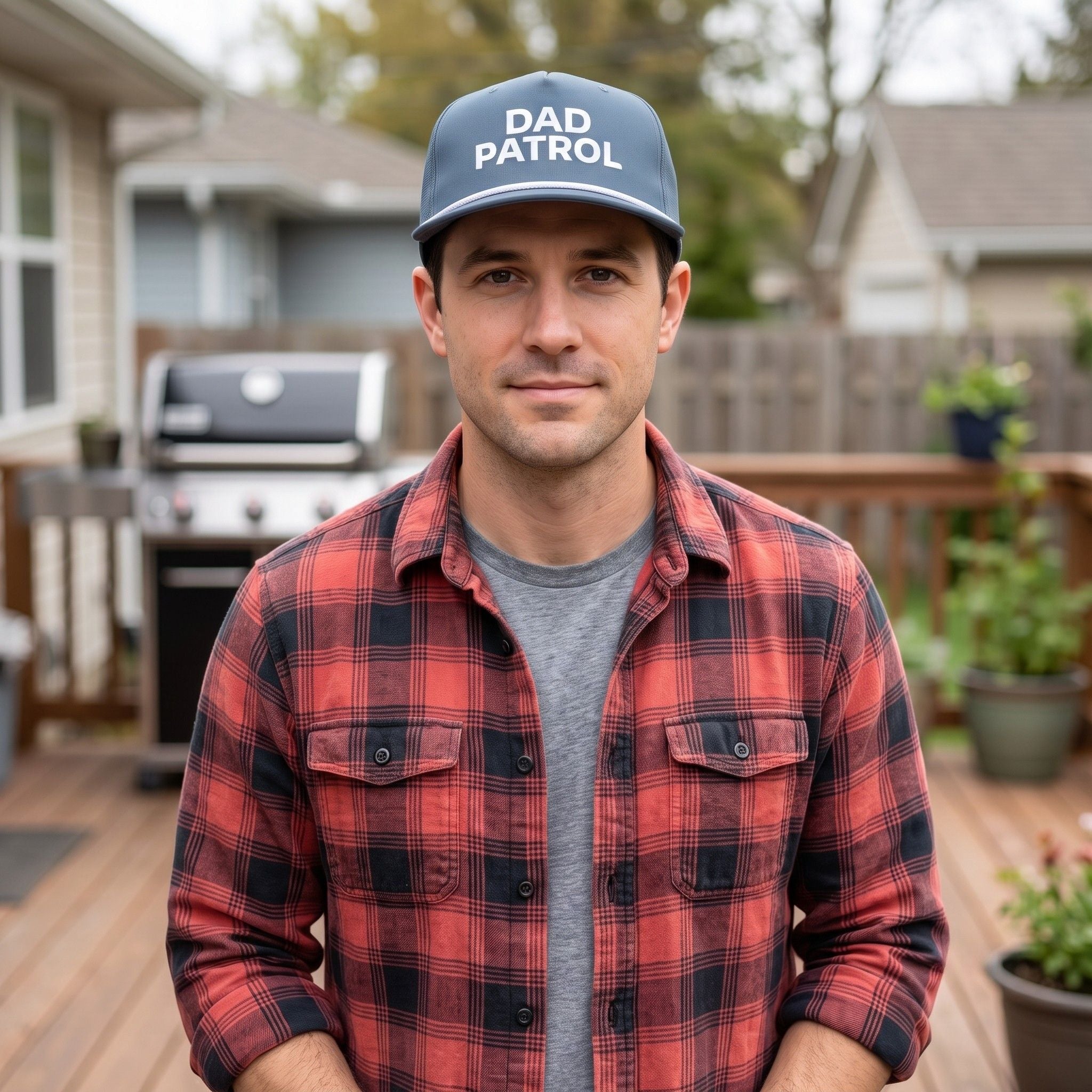 Image of a man wearing an indigo cap with "Dad Patrol" embroidery 